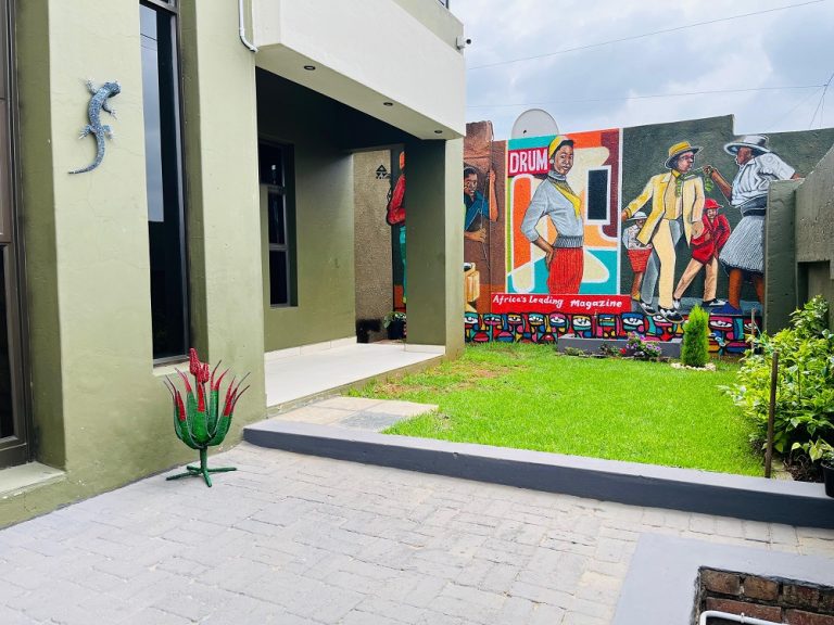 Garden courtyard with mural at Soweto Boutique Hotel